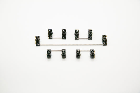 Overhead shot of PCB mounted black mechanical keyboard Durock stabilizer kit in 7u configuration with screws and washers